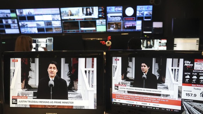 Canada Prime Minister Justin Trudeau is seen on screens in a control room at City News in Toronto as he holds a new conference in Ottawa on Monday, Jan. 6, 2025. (Chris Young/The Canadian Press via AP)