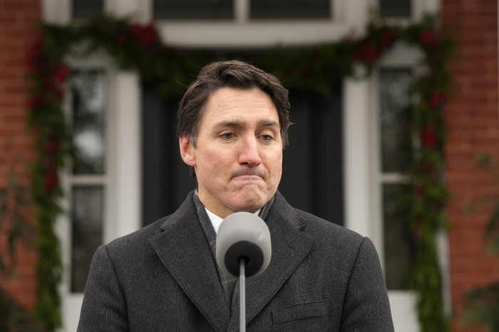 Prime Minister Justin Trudeau makes an announcement outside Rideau Cottage in Ottawa on Monday, Jan. 6, 2025. (Adrian Wyld/The Canadian Press via AP)