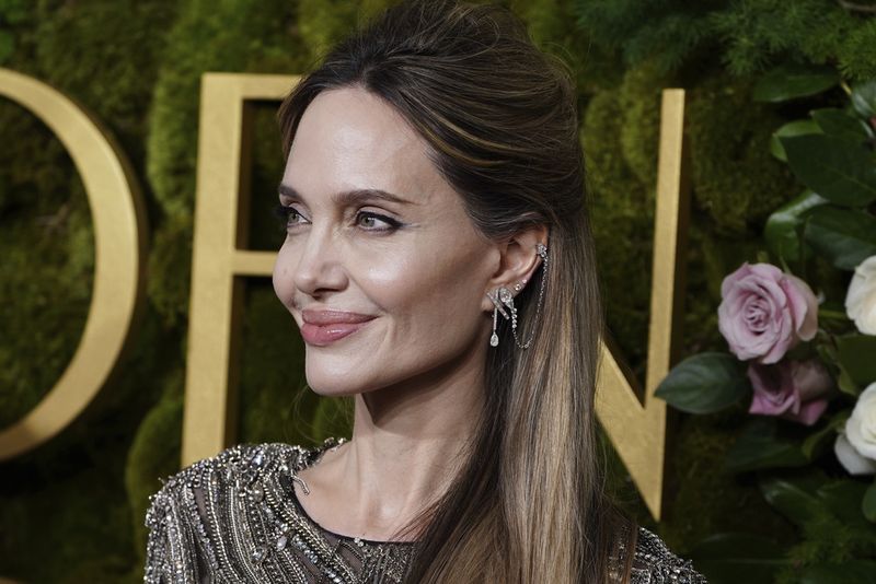 Angelina Jolie arrives at the 82nd Golden Globes on Sunday, Jan. 5, 2025, at the Beverly Hilton in Beverly Hills, Calif. (Photo by Jordan Strauss/Invision/AP)