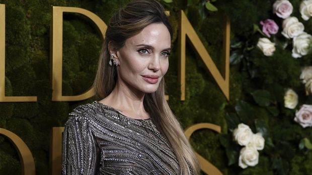 Angelina Jolie arrives at the 82nd Golden Globes on Sunday, Jan. 5, 2025, at the Beverly Hilton in Beverly Hills, Calif. (Photo by Jordan Strauss/Invision/AP)