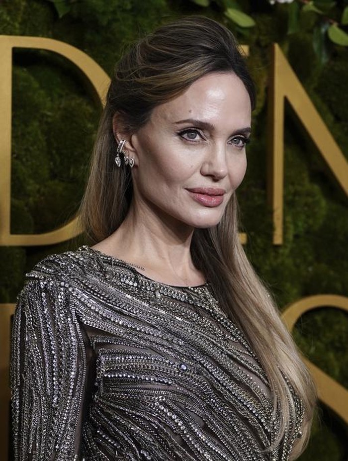 Angelina Jolie arrives at the 82nd Golden Globes on Sunday, Jan. 5, 2025, at the Beverly Hilton in Beverly Hills, Calif. (Photo by Jordan Strauss/Invision/AP)