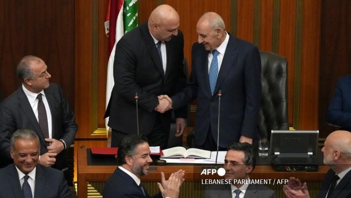 This handout photo released by the Lebanese parliament shows Newly elected Lebanese president Joseph Aoun (C) being congratulated by parliament speaker Nabih Berri during a parliamentary session to elect a president, in Beirut, on January 9, 2025. Lebanese army chief Joseph Aoun, the frontrunner in todays vote for president, is seen as a man of integrity best placed to maintain a fragile ceasefire and pull the country out of financial collapse. (Photo by LEBANESE PARLIAMENT / AFP) / XGTY / === RESTRICTED TO EDITORIAL USE - MANDATORY CREDIT AFP PHOTO / HO /Lebanese Parliament  - NO MARKETING - NO ADVERTISING CAMPAIGNS - DISTRIBUTED AS A SERVICE TO CLIENTS ===
