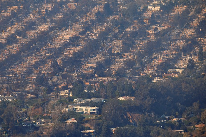 An aerial view shows debris from burned properties, following the Palisades Fire at the Pacific Palisades neighborhood in Los Angeles, California, U.S. January 10, 2025. REUTERS/Daniel Cole