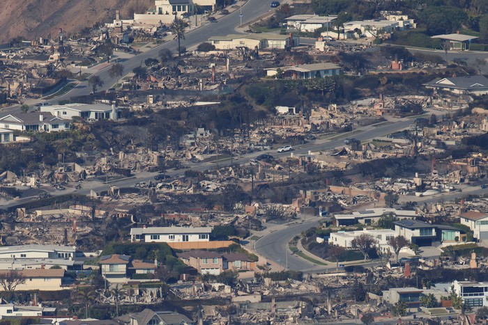 An aerial view shows debris from burned properties, following the Palisades Fire at the Pacific Palisades neighborhood in Los Angeles, California, U.S. January 10, 2025. REUTERS/Daniel Cole