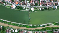 Foto udara waduk atau long storage Kalimati di Tarik, Sidoarjo, Jawa Timur, Minggu (12/1/2025). 