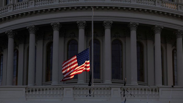A U.S. flag flutters at sunrise in front of the U.S. Capitol ahead of the presidential inauguration of U.S. President-elect Donald Trump, in Washington, U.S., January 12, 2025. REUTERS/Marko Djurica