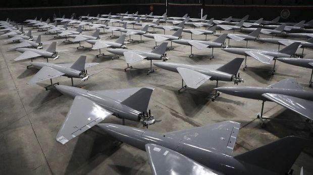 In this photo provided Monday, Jan. 13, 2025, by the Iranian Army, domestically-built drones are displayed in a ceremony to deliver the drones to the army in an undisclosed location in Iran. (Iranian Army via AP)
