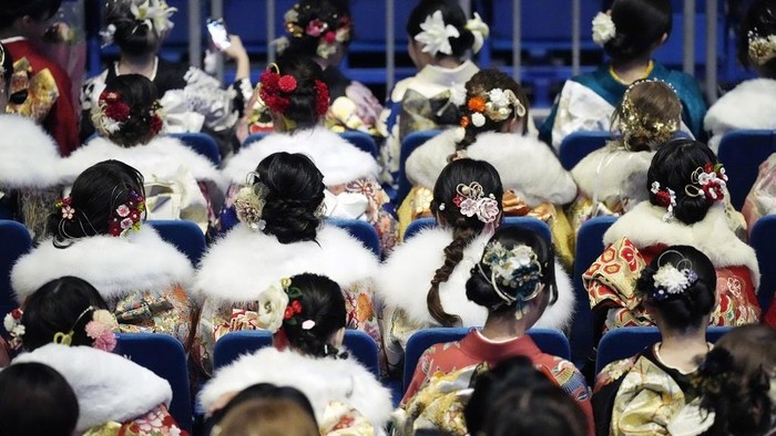 Kimono-clad women celebrate the Coming-of-Age Day, a centuries-old tradition and national holiday celebrating the milestone from child to adult, in Yokohama near Tokyo, Monday, Jan. 13, 2025. (AP Photo/Eugene Hoshiko)