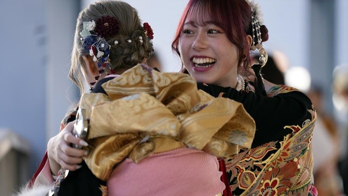 Kimono-clad women celebrate the Coming-of-Age Day, a centuries-old tradition and national holiday celebrating the milestone from child to adult, in Yokohama near Tokyo, Monday, Jan. 13, 2025. (AP Photo/Eugene Hoshiko)