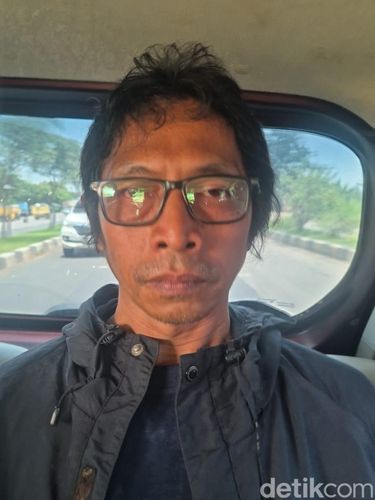 Tampang Nanang 'Gimbal' pembunuh Sandy Permana ditangkap polisi.