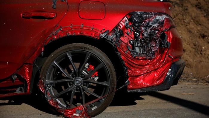 A car that was damaged by the Palisades Fire is seen on a road in Malibu, California, U.S., January 16, 2025. REUTERS/Mike Blake