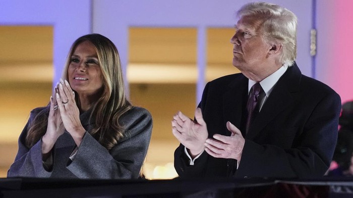 President-elect Donald Trump, right, and Melania Trump watch fireworks at Trump National Golf Club in Sterling, Va., Saturday, Jan. 18, 2025, ahead of the 60th Presidential Inauguration. (AP Photo/Matt Rourke)
