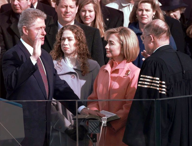 President Clinton is sworn in for his second term Monday, Jan. 20, 1997, in Washington by Chief Justice of the United States William Rehniquist, while his wife Hillary and daughter Chelsea watch. (AP Photo/Ron Edmonds)