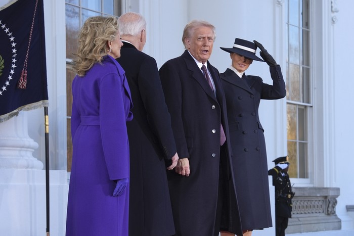 President Joe Biden, center left, and first lady Jill Biden, left, speak with President-elect Donald Trump, center right, and Melania Trump, right, upon arriving at the White House, Monday, Jan. 20, 2025, in Washington. (AP Photo/Evan Vucci)