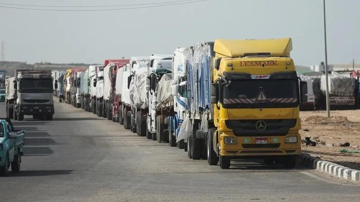 Aid trucks wait near the Rafah border crossing between Egypt and the Gaza Strip, amid a ceasefire between Israel and Hamas, in Rafah, Egypt, January 19, 2025. (Reuters)
