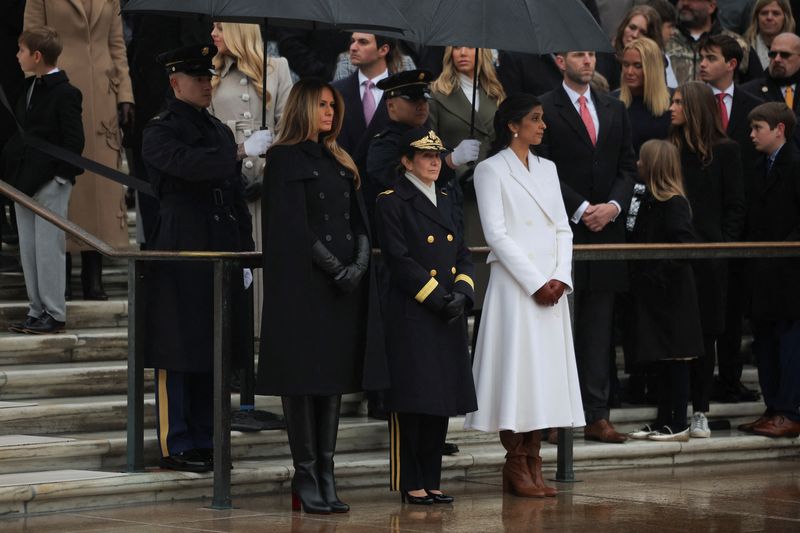 Melania Trump watches as President-elect Donald Trump participates in a wreath laying ceremony at the Tomb of the Unknown Solider at Arlington National Cemetery, Sunday, Jan. 19, 2025, in Arlington, Va. (AP Photo/Evan Vucci)