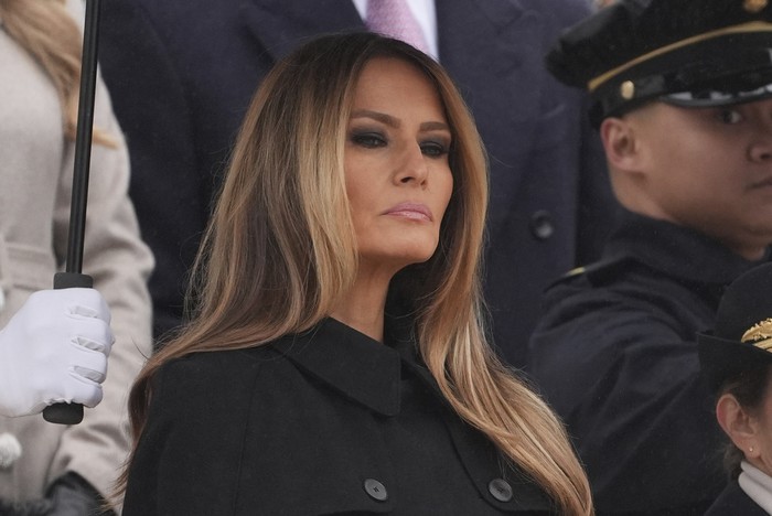 Melania Trump watches as President-elect Donald Trump participates in a wreath laying ceremony at the Tomb of the Unknown Solider at Arlington National Cemetery, Sunday, Jan. 19, 2025, in Arlington, Va. (AP Photo/Evan Vucci)
