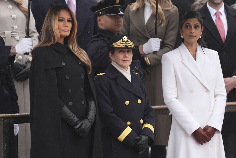 Melania Trump watches as President-elect Donald Trump participates in a wreath laying ceremony at the Tomb of the Unknown Solider at Arlington National Cemetery, Sunday, Jan. 19, 2025, in Arlington, Va. (AP Photo/Evan Vucci)