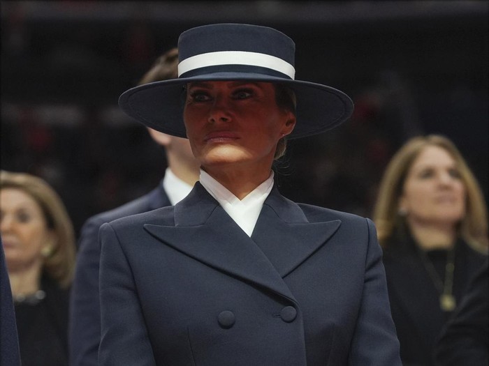 President Donald Trump and first lady Melania Trump arrive at an indoor Presidential Inauguration parade event at Capital One Arena, Monday, Jan. 20, 2025, in Washington. (AP Photo/Evan Vucci)
