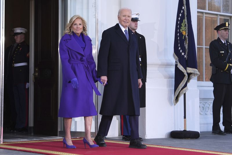 President Joe Biden, center left, and first lady Jill Biden, left, greet President-elect Donald Trump, center right, and Melania Trump, right, upon arriving at the White House, Monday, Jan. 20, 2025, in Washington. (AP Photo/Evan Vucci)