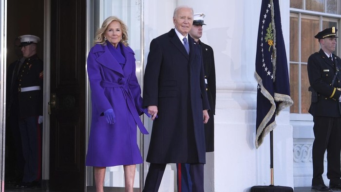 President Joe Biden, center left, and first lady Jill Biden, left, greet President-elect Donald Trump, center right, and Melania Trump, right, upon arriving at the White House, Monday, Jan. 20, 2025, in Washington. (AP Photo/Evan Vucci)