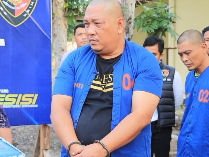 Tampang pelaku Hudian saat ditangkap petugas kepolisian.