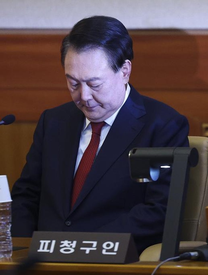 Impeached South Korean President Yoon Suk Yeol attends his impeachment trial at the Constitutional Court in Seoul, South Korea, Tuesday, Jan. 21, 2025. (Kim Hong-Ji/Pool Photo via AP)