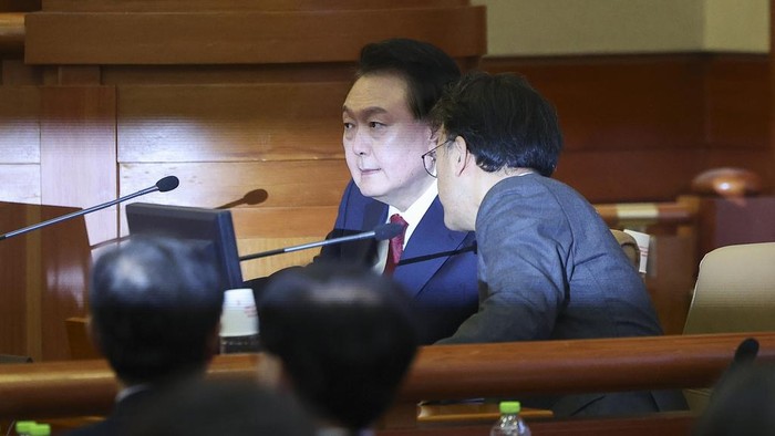 Impeached South Korean President Yoon Suk Yeol attends his impeachment trial at the Constitutional Court in Seoul, South Korea, Tuesday, Jan. 21, 2025. (Kim Hong-Ji/Pool Photo via AP)