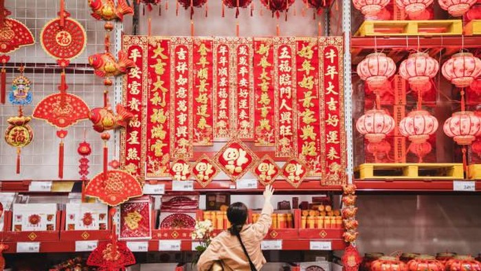 Chinese New Year decoration Asian woman shopping for Chinese New Year decoration