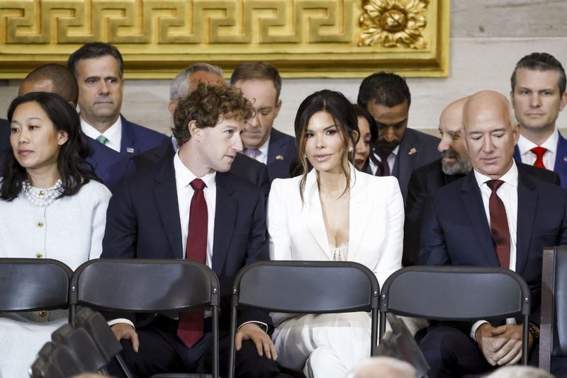 US-THE-INAUGURATION-OF-DONALD-J.-TRUMP-AS-THE-47TH-PRESIDENT WASHINGTON, DC - JANUARY 20: (L-R) Priscilla Chan, Meta CEO Mark Zuckerberg, Lauren Sanchez, and businessman Jeff Bezos, among other dignitaries, attend the United States Capitol on January 20, 2025 in Washington, DC. Donald Trump takes office for his second term as the 47th President of the United States. Shawn Thew-Pool/Getty Images/AFP (Photo by POOL / GETTY IMAGES NORTH AMERICA / Getty Images via AFP)