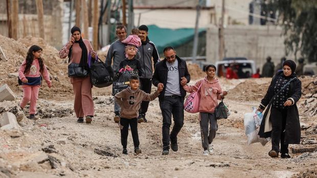 Tamer Abu Zaho, who tried to deliver bread, medicines and diapers to his mother, who is trapped inside a Jenin hospital amid an Israeli raid, stands, in the Israeli-occupied West Bank, January 22, 2025. REUTERS/Ammar Awad