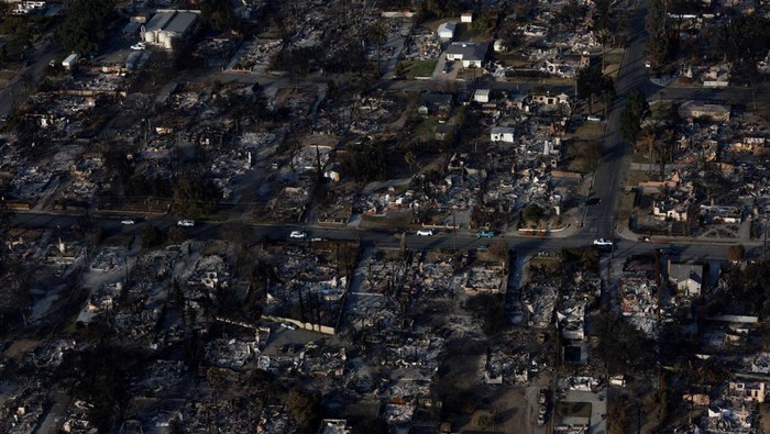 An aerial view of the fire damage caused by the Eaton Fire is shown in Altadena, California, U.S. January 22, 2025. REUTERS/Mike Blake