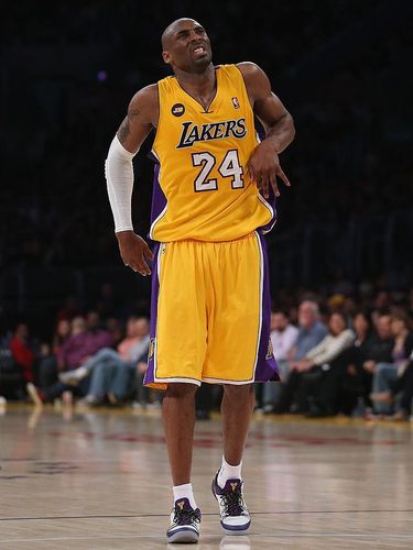 LOS ANGELES, CA - APRIL 12:  Kobe Bryant #24 of the Los Angeles Lakers appears to injure himself against the Golden State Warriors in the third quarter at Staples Center on April 12, 2013 in Los Angeles, California. The Lakers defeated the Warriors 118-116. NOTE TO USER: User expressly acknowledges and agrees that, by downloading and or using this photograph, User is consenting to the terms and conditions of the Getty Images License Agreement.  (Photo by Jeff Gross/Getty Images)