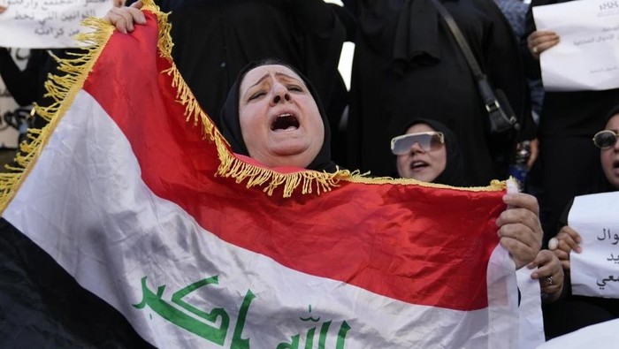 Protesters gather to demonstrate against a proposed law to permit underage female marriage in Tahrir Square in Baghdad, Iraq, Aug. 8, 2024. (AP Photo/Hadi Mizban, File)