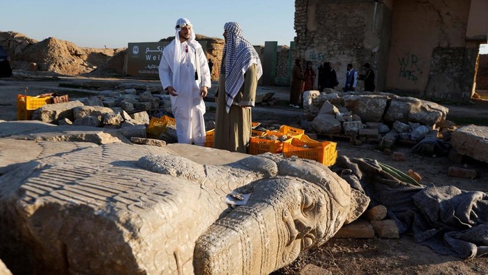 People visit the remains of the archaeological site of Nimrud, which was destroyed by Islamic State militants in the Assyrian city of Nimrud, on the eastern bank of the Tigris River, outskirts of Mosul, Iraq, January 31, 2025. REUTERS/Khalid al-Mousily