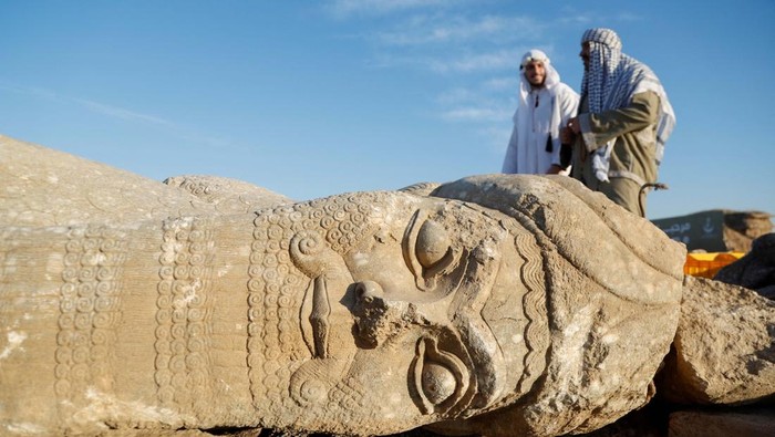 People visit the remains of the archaeological site of Nimrud, which was destroyed by Islamic State militants in the Assyrian city of Nimrud, on the eastern bank of the Tigris River, outskirts of Mosul, Iraq, January 31, 2025. REUTERS/Khalid al-Mousily