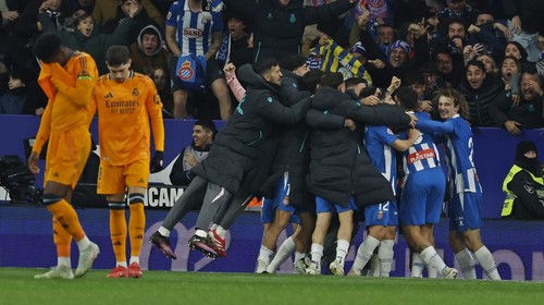 Espanyol players celebrate after Carlos Romero scored the opening goal during a Spanish La Liga soccer match between Espanyol and Real Madrid at the Lluis Companys Olympic Stadium in Barcelona, Spain, Saturday Feb.1, 2025. (AP Photo/Joan Monfort)