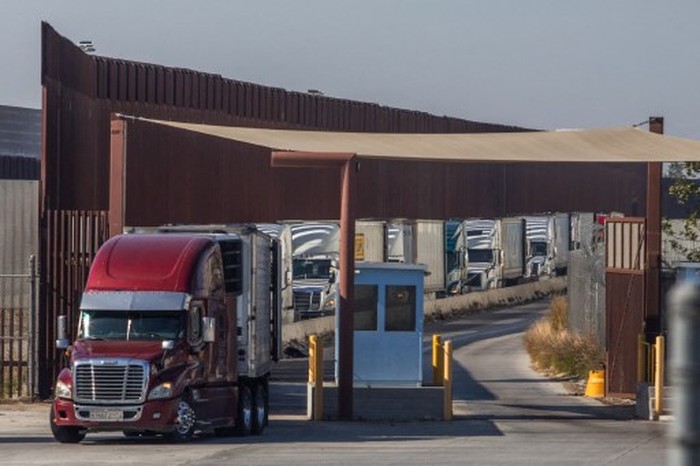  Trucks line-up to drive into Mexico at the Otay Mesa Port of Entry, on the U.S.-Mexico border on February 1, 2025 in San Diego, California. President Trump implemented 25% tariffs on Mexico and Canada as well as a 10% duty on China which began today, in retaliation for what the administration says is 