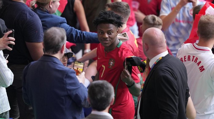 U.S. YouTuber and rapper Darren Jason Watkins Jr., known online as IShowSpeed or Speed, waits to take his place in the stands ahead of a Group F match between Georgia and Portugal at the Euro 2024 soccer tournament in Gelsenkirchen, Germany, Wednesday, June 26, 2024. (AP Photo/Andreea Alexandru)