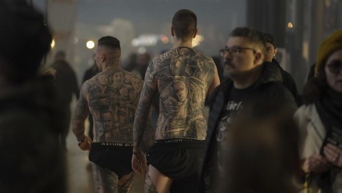 A man with a tattoo on his chest takes part in a contest during a tattoo convention, in Paris, Sunday, Feb. 2, 2025. (AP Photo/Thibault Camus)