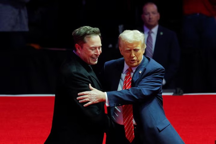 U.S. President-elect Donald Trump greets Tesla CEO and X owner Elon Musk during a rally the day before Trump is scheduled to be inaugurated for a second term, in Washington, U.S., January 19, 2025. REUTERS/Brian Snyder/File Photo Purchase Licensing Rights