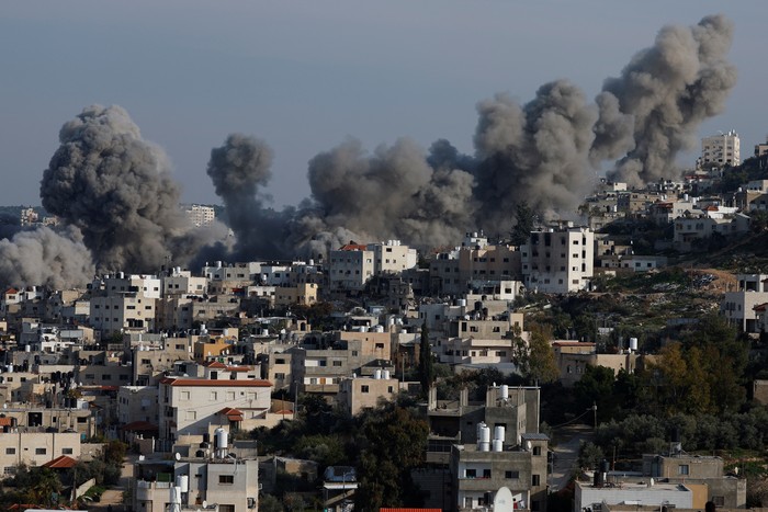 Smoke rises during an Israeli army operation in Jenin, in the Israeli-occupied West Bank, February 2, 2025. REUTERS/Mohammed Torokman