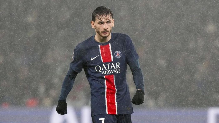 PSGs Khvicha Kvaratskhelia stands on the pitch during the French League One soccer match between Paris Saint-Germain and Reims at Parc des Princes stadium in Paris, Saturday, Jan. 25, 2025. (AP Photo/Michel Euler)