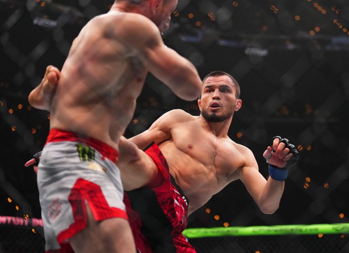 INGLEWOOD, CALIFORNIA - JANUARY 18: (R-L) Umar Nurmagomedov of Russia kicks Merab Dvalishvili of Georgia in the UFC bantamweight championship fight during the UFC 311 event at Intuit Dome on January 18, 2025 in Inglewood, California. (Photo by Cooper Neill/Zuffa LLC)
