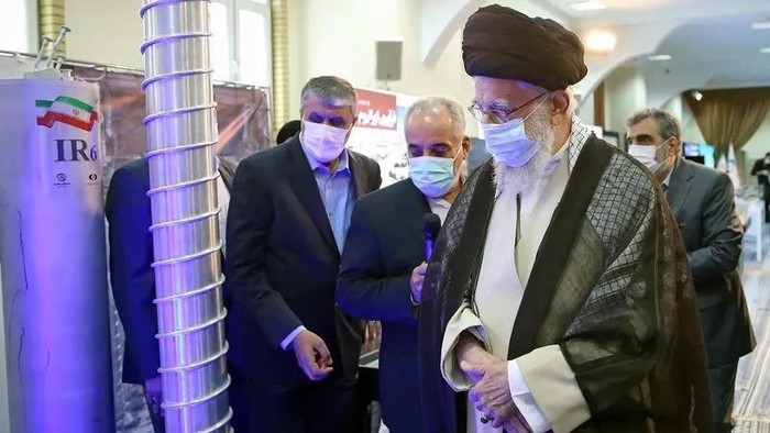 A handout picture made available by the office of Iran’s Supreme Leader Ali Khamenei shows him (front) visiting an exhibition of the country’s nuclear industry achievements in Tehran. (Via AFP)