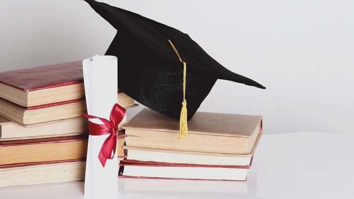 Graduation. Square academic hat with books