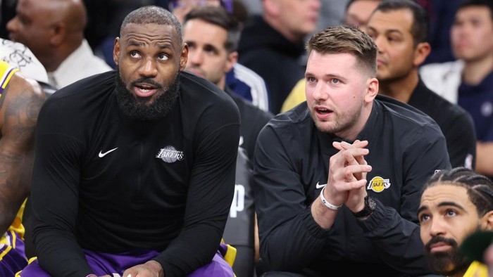 Inglewood, California February 4, 2025-Lakers LeBron James, left, and Luka Doncic sit next to the bench against the Clippers in the second half at the Intuit Dome Tuesday. (Wally Skalij/Los Angeles Times via Getty Images)