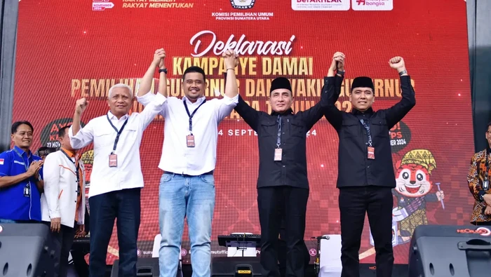 Edy Rahmayadi-Hasan Basri Sagala bergandengan tangan dengan Bobby Nasution-Surya