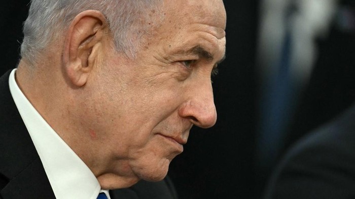 Israeli Prime Minister Benjamin Netanyahu looks on during a meeting with US Secretary of Defense Pete Hegseth (out of frame) at the Pentagon in Arlington, Virginia, on February 5, 2025. (Photo by Jim WATSON / AFP)