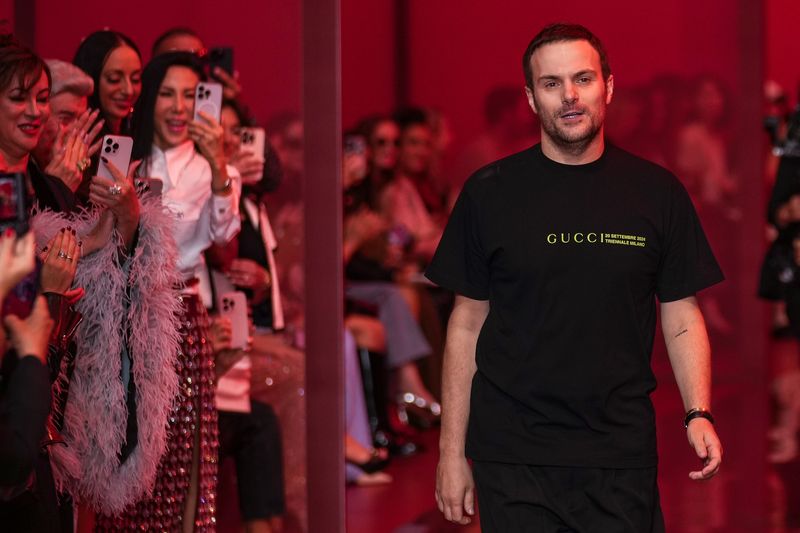Sabato De Sarno, creative director of Gucci, accepts applause after the Gucci Spring Summer 2025 collection, that was presented in Milan, Italy, Friday, Sept. 20, 2024. (AP Photo/Luca Bruno).